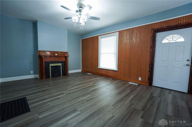 3409 E 5th St, Dayton, OH 45403 - unfurnished living room with baseboards, a ceiling fan, wood finished floors, and a fireplace