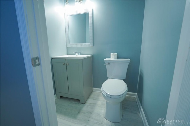3409 E 5th St, Dayton, OH 45403 - half bathroom with vanity, toilet, and baseboards