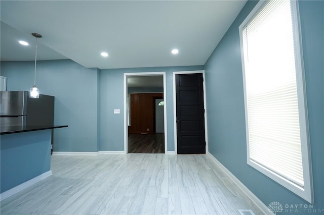 3409 E 5th St, Dayton, OH 45403 - unfurnished living room featuring light wood finished floors, baseboards, and recessed lighting