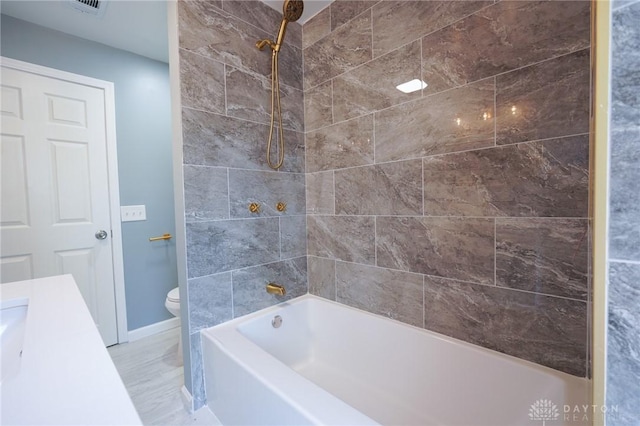 3409 E 5th St, Dayton, OH 45403 - full bath with toilet, shower / bathtub combination, baseboards, and vanity
