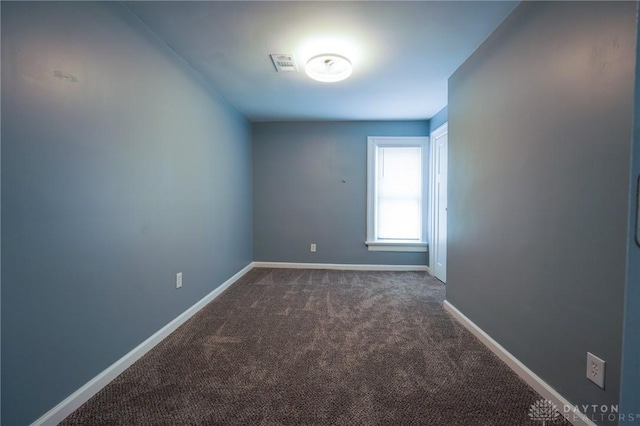 3409 E 5th St, Dayton, OH 45403 - unfurnished room featuring dark carpet and baseboards