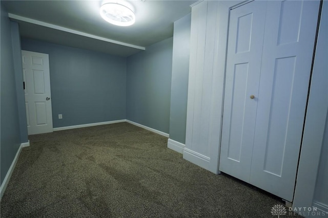 3409 E 5th St, Dayton, OH 45403 - spare room featuring dark carpet and baseboards