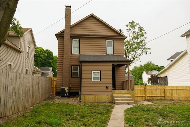 3409 E 5th St, Dayton, OH 45403 - rear view of property with central AC and a chimney