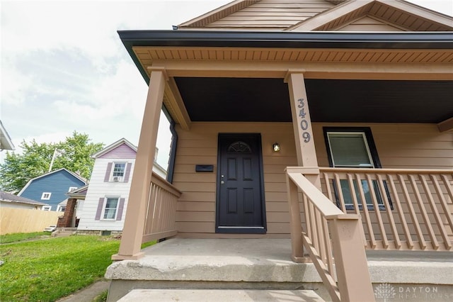 3409 E 5th St, Dayton, OH 45403 - view of exterior entry with a porch and a yard