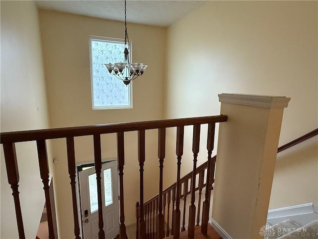1529 Creekside Rd, Amelia, OH 45102 - stairway featuring a chandelier and baseboards