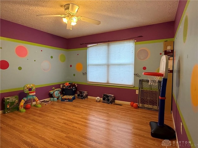 1529 Creekside Rd, Amelia, OH 45102 - game room with wood finished floors, a textured ceiling, and ceiling fan