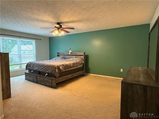 1529 Creekside Rd, Amelia, OH 45102 - carpeted bedroom featuring a textured ceiling, baseboards, and ceiling fan