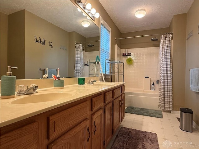 1529 Creekside Rd, Amelia, OH 45102 - bathroom featuring double vanity, shower / bath combo with shower curtain, a textured ceiling, and baseboards