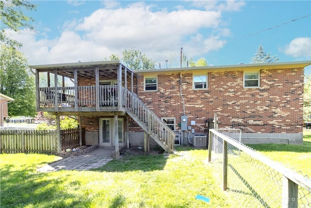 2706 Coldsprings Dr, Beavercreek, OH 45434 - back of house with a fenced backyard, stairs, a wooden deck, brick siding, and a patio area