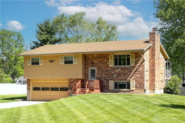 2706 Coldsprings Dr, Beavercreek, OH 45434 - bi-level home featuring a chimney, a garage, brick siding, driveway, and roof with shingles