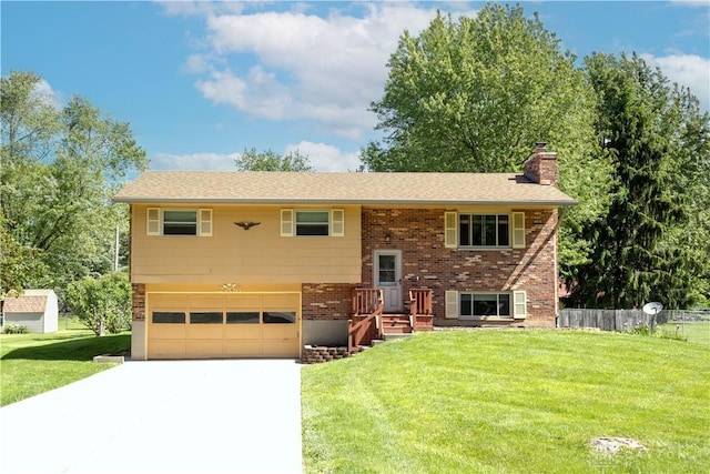 2706 Coldsprings Dr, Beavercreek, OH 45434 - bi-level home with a chimney, a garage, brick siding, and driveway