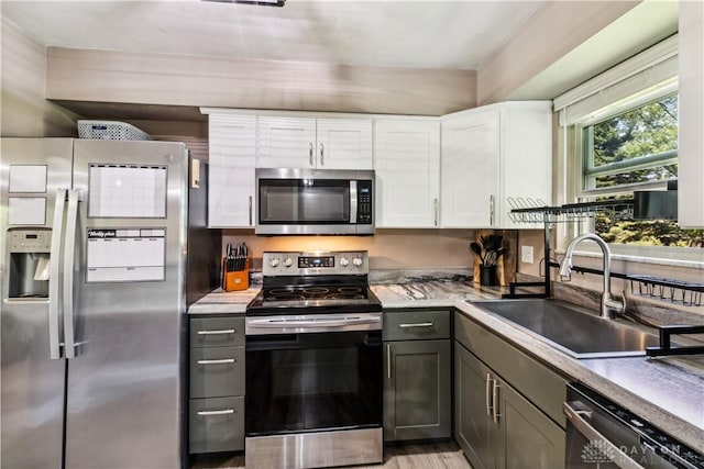 2706 Coldsprings Dr, Beavercreek, OH 45434 - kitchen featuring stainless steel appliances, white cabinetry, light countertops, and gray cabinetry