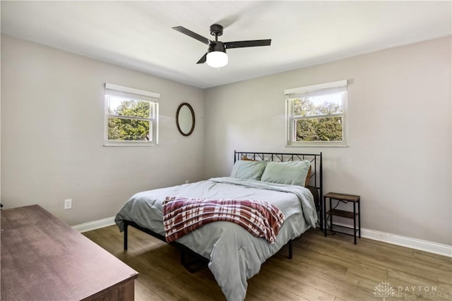 2706 Coldsprings Dr, Beavercreek, OH 45434 - bedroom featuring multiple windows, wood finished floors, and a ceiling fan