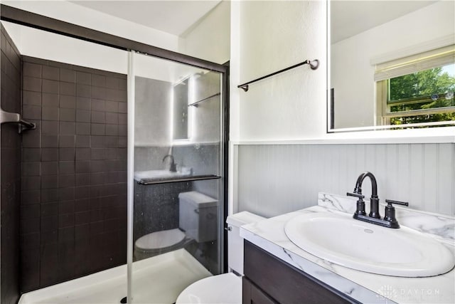 2706 Coldsprings Dr, Beavercreek, OH 45434 - bathroom with a shower stall, vanity, and a wainscoted wall