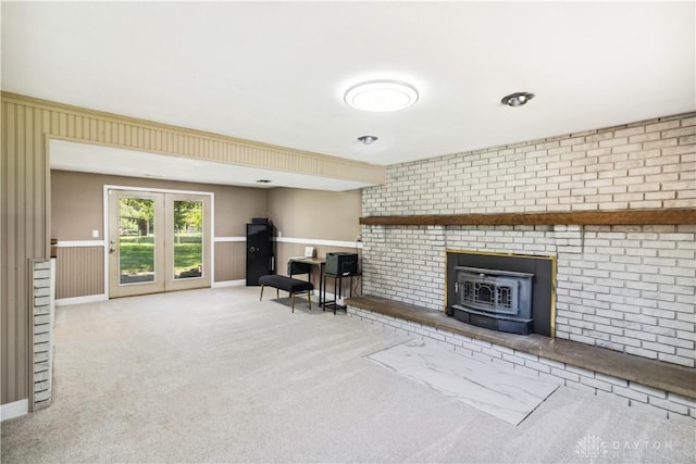 2706 Coldsprings Dr, Beavercreek, OH 45434 - living room with a wood stove, carpet, and wainscoting