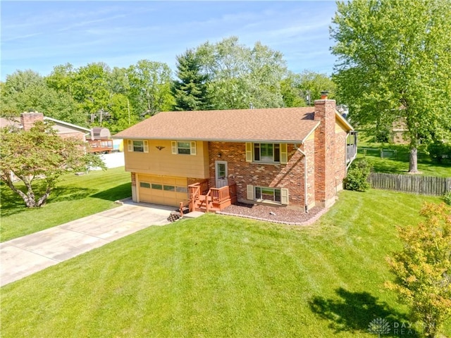 2706 Coldsprings Dr, Beavercreek, OH 45434 - split foyer home featuring a chimney, an attached garage, driveway, and brick siding