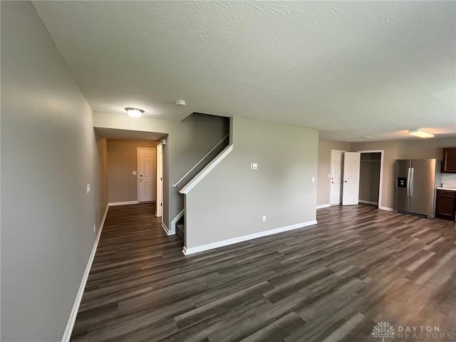 821 Prescot Cir, Trenton, OH 45067 - unfurnished living room with dark wood-type flooring and stairs