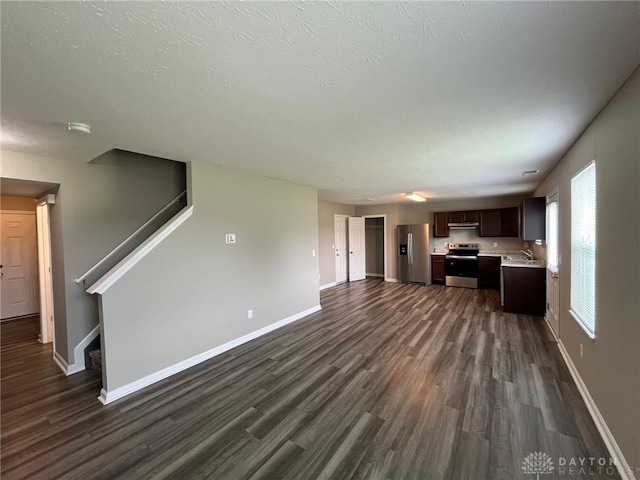821 Prescot Cir, Trenton, OH 45067 - unfurnished living room with dark wood-type flooring and stairs