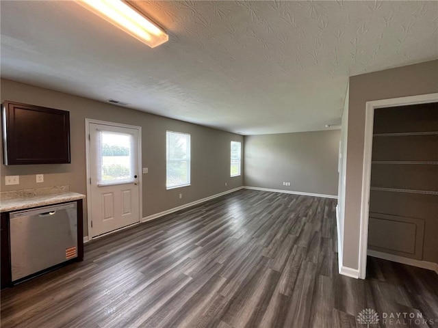 821 Prescot Cir, Trenton, OH 45067 - unfurnished living room featuring a textured ceiling and dark wood finished floors