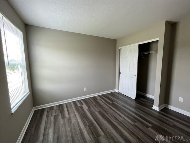 821 Prescot Cir, Trenton, OH 45067 - unfurnished bedroom featuring dark wood-style floors and a closet