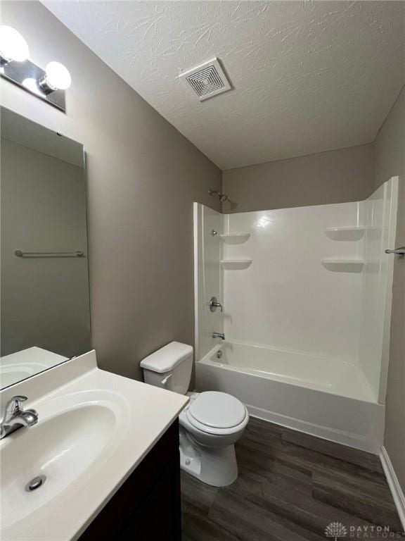 821 Prescot Cir, Trenton, OH 45067 - full bathroom with wood finished floors, vanity, bathtub / shower combination, and a textured ceiling