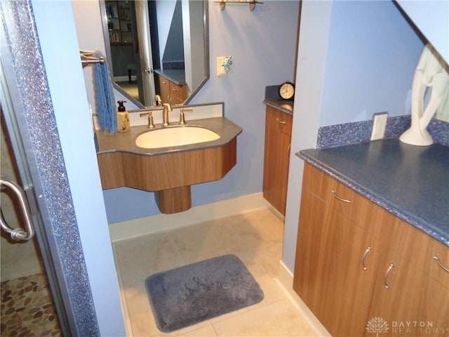 4502 Central Ave, Middletown, OH 45044 - bathroom featuring a sink, tile patterned flooring, and baseboards