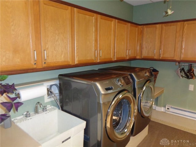 4502 Central Ave, Middletown, OH 45044 - laundry room with baseboard heating, cabinet space, and independent washer and dryer