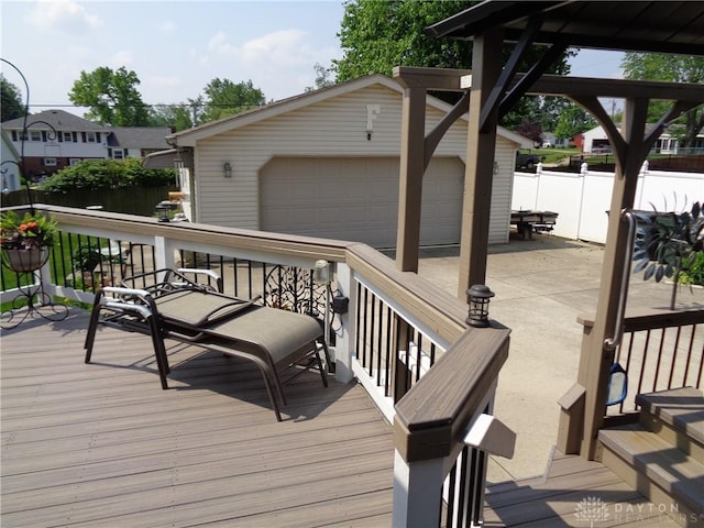 4502 Central Ave, Middletown, OH 45044 - wooden deck featuring a detached garage and an outbuilding
