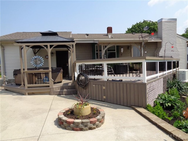 4502 Central Ave, Middletown, OH 45044 - view of front of house with a gazebo, a wooden deck, a patio, and roof with shingles