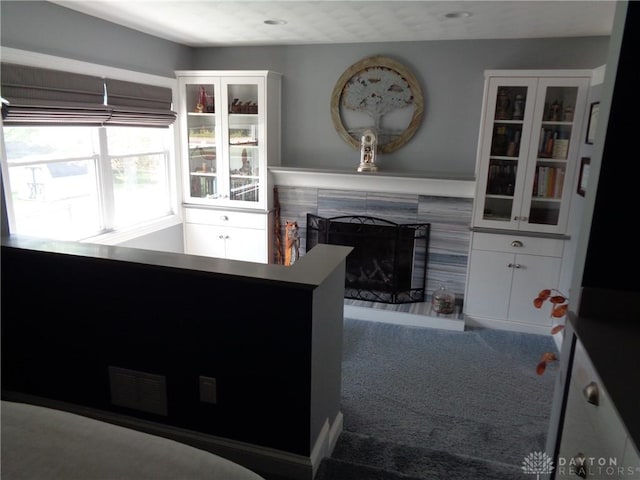 4502 Central Ave, Middletown, OH 45044 - carpeted living area featuring a tile fireplace