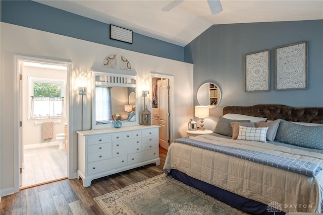 1199 Whitetail Dr, Fairborn, OH 45324 - bedroom featuring dark wood-type flooring, lofted ceiling, connected bathroom, baseboards, and ceiling fan