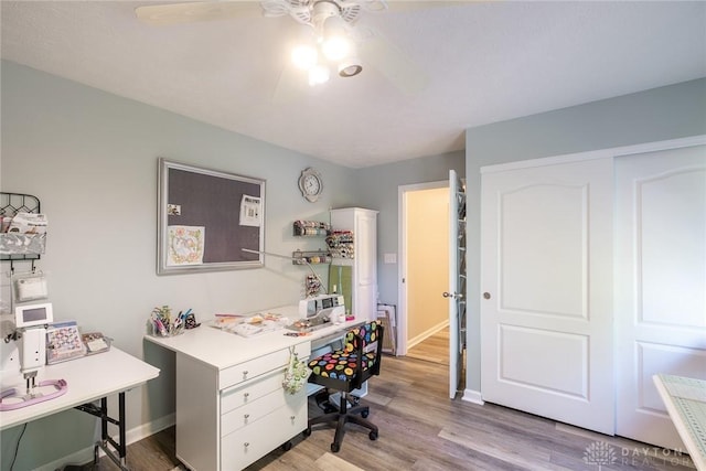 1199 Whitetail Dr, Fairborn, OH 45324 - home office featuring a ceiling fan, light wood-style flooring, and baseboards