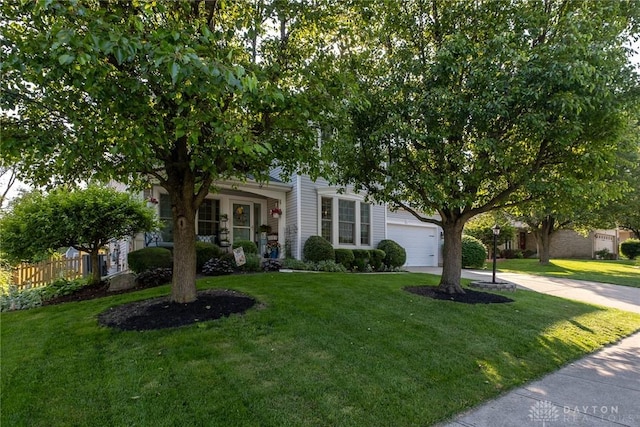 1199 Whitetail Dr, Fairborn, OH 45324 - view of property hidden behind natural elements with driveway and an attached garage