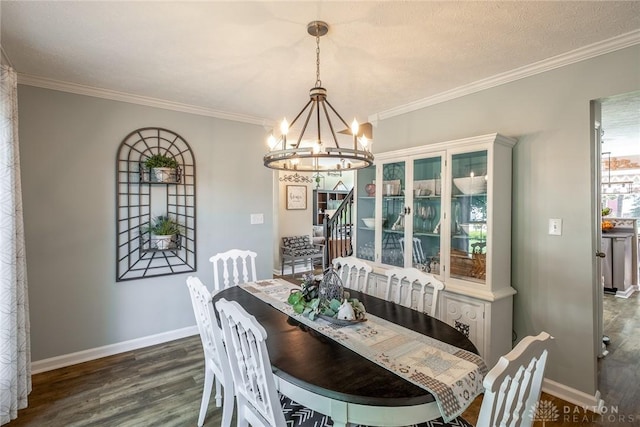 1199 Whitetail Dr, Fairborn, OH 45324 - dining space with a chandelier, wood finished floors, baseboards, and crown molding