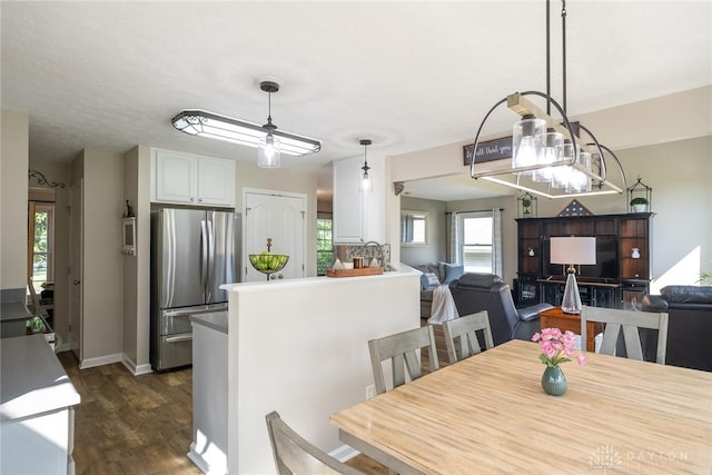 1199 Whitetail Dr, Fairborn, OH 45324 - dining area with dark wood-style floors and baseboards