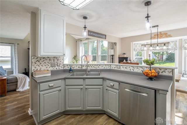 1199 Whitetail Dr, Fairborn, OH 45324 - kitchen with stainless steel dishwasher, a sink, backsplash, dark wood-style floors, and white cabinets