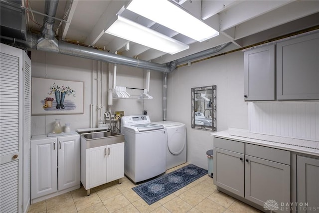 1199 Whitetail Dr, Fairborn, OH 45324 - laundry area featuring cabinet space, separate washer and dryer, and light tile patterned floors