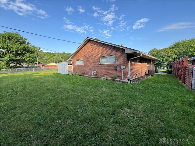 3645 Endover Rd, Dayton, OH 45439 - view of side of home featuring central AC and brick siding