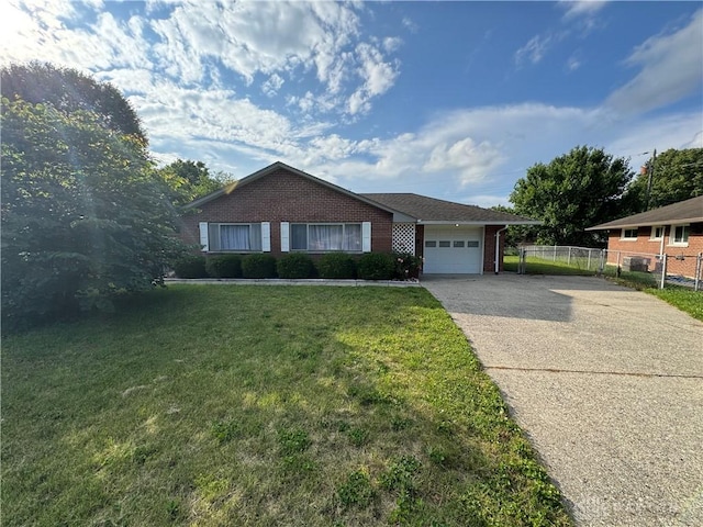 3645 Endover Rd, Dayton, OH 45439 - ranch-style house with concrete driveway, a garage, and brick siding