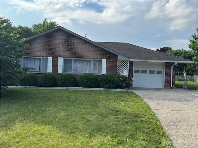 3645 Endover Rd, Dayton, OH 45439 - single story home with brick siding, a garage, driveway, and a shingled roof