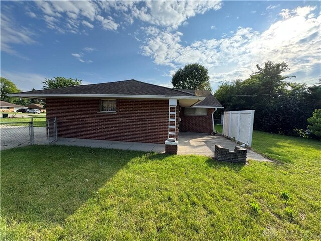 3645 Endover Rd, Dayton, OH 45439 - rear view of house featuring a patio area and brick siding