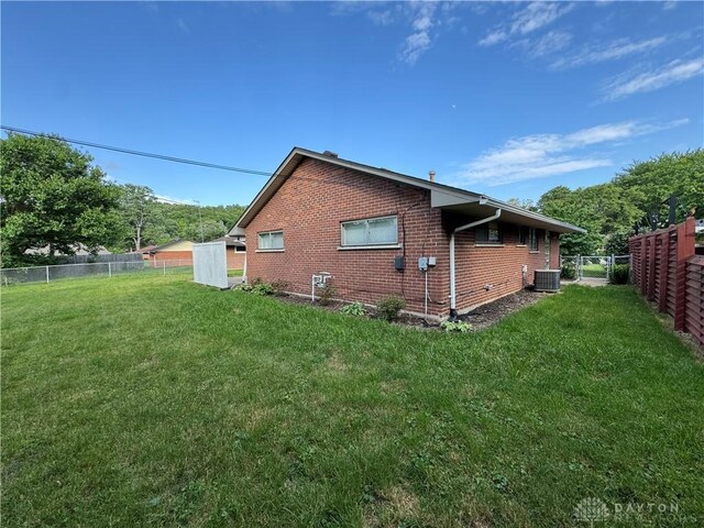 3645 Endover Rd, Dayton, OH 45439 - view of home's exterior with brick siding and central AC