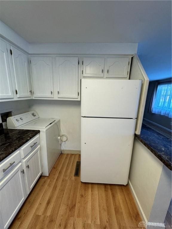3645 Endover Rd, Dayton, OH 45439 - washroom with light wood finished floors, baseboards, and cabinet space