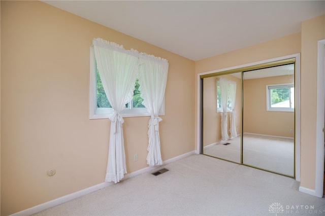4424 Appleton Pl, Kettering, OH 45440 - unfurnished bedroom featuring carpet floors and a closet