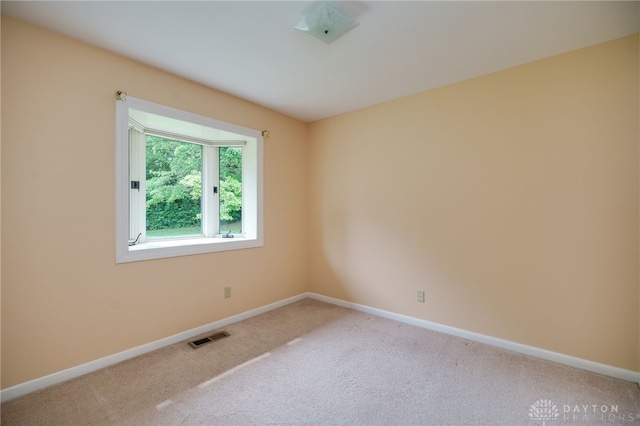 4424 Appleton Pl, Kettering, OH 45440 - spare room featuring light colored carpet and baseboards