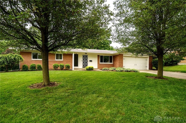 4424 Appleton Pl, Kettering, OH 45440 - single story home with driveway, an attached garage, a front yard, and brick siding