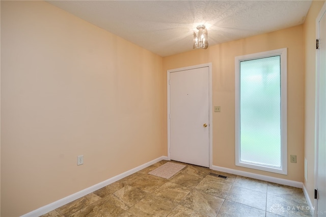 4424 Appleton Pl, Kettering, OH 45440 - foyer with baseboards and a chandelier