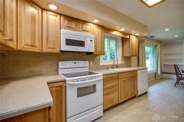 4424 Appleton Pl, Kettering, OH 45440 - kitchen featuring white appliances, tasteful backsplash, light countertops, and recessed lighting