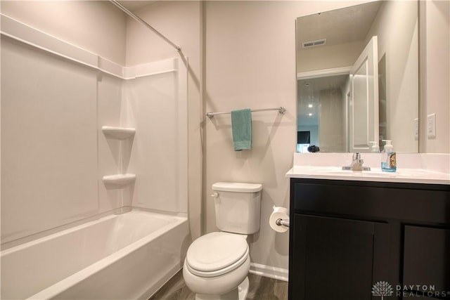 95 Whitney Way, West Milton, OH 45383 - bathroom with toilet, vanity, washtub / shower combination, baseboards, and wood finished floors
