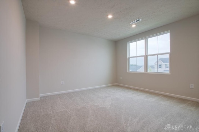95 Whitney Way, West Milton, OH 45383 - unfurnished room with light colored carpet, baseboards, recessed lighting, and a textured ceiling